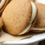 Pumpkin Whoopie pies on a white footed cake dish
