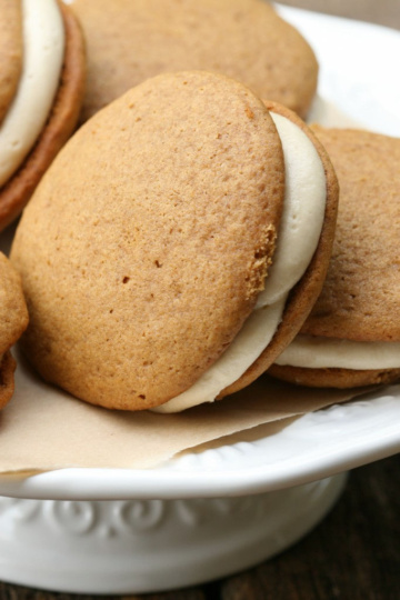 Pumpkin Whoopie pies on a white footed cake dish