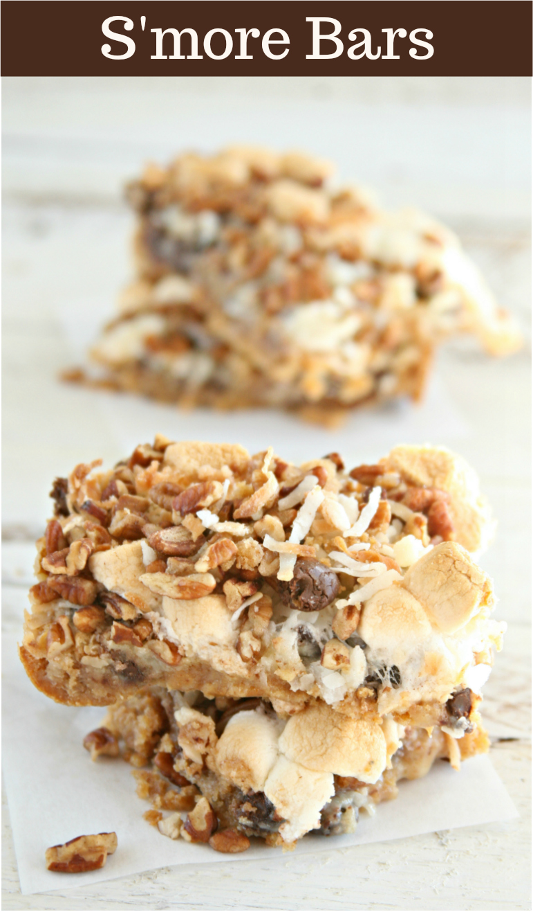 Crushed graham crackers, melted chocolate, and gooey marshmallows with toasted coconut make this delicious S'more Bars. #smoresbars #smores #chocolate #homemade