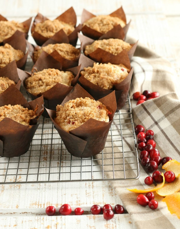 muffins in brown paper muffin cups cooling on baking rack