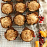 Cranberry Orange muffins with crumb topping in brown tulip style paper cupcake liners