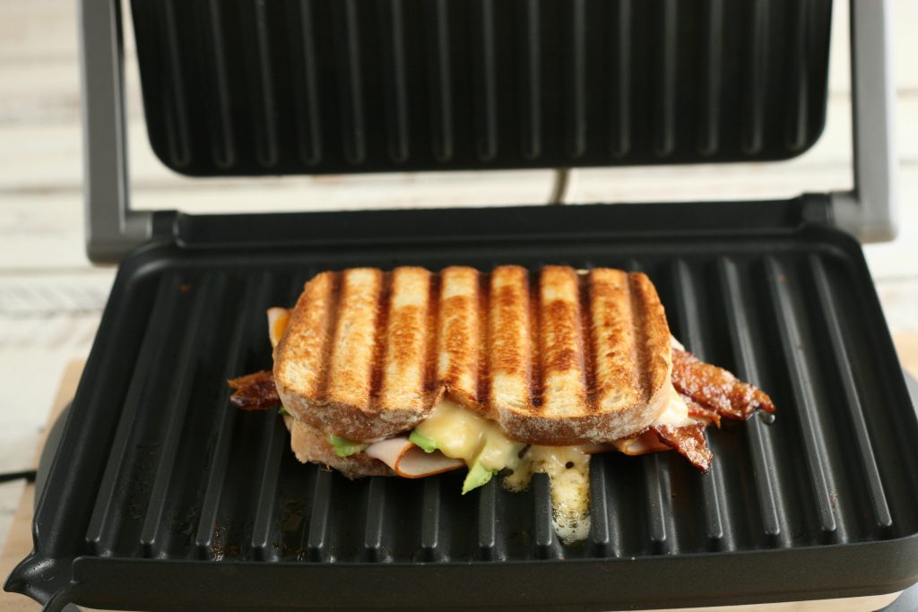 turkey bacon avocado panini grilled on a panini press