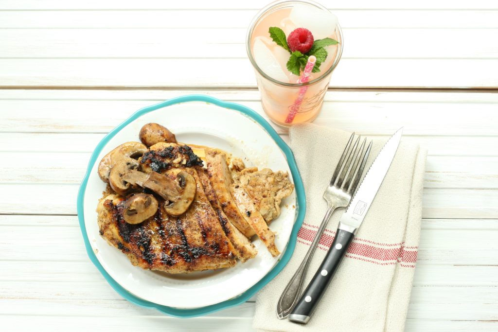 Maple Whiskey Grilled Chicken with sauteed mushrooms and glass of pink lemonade