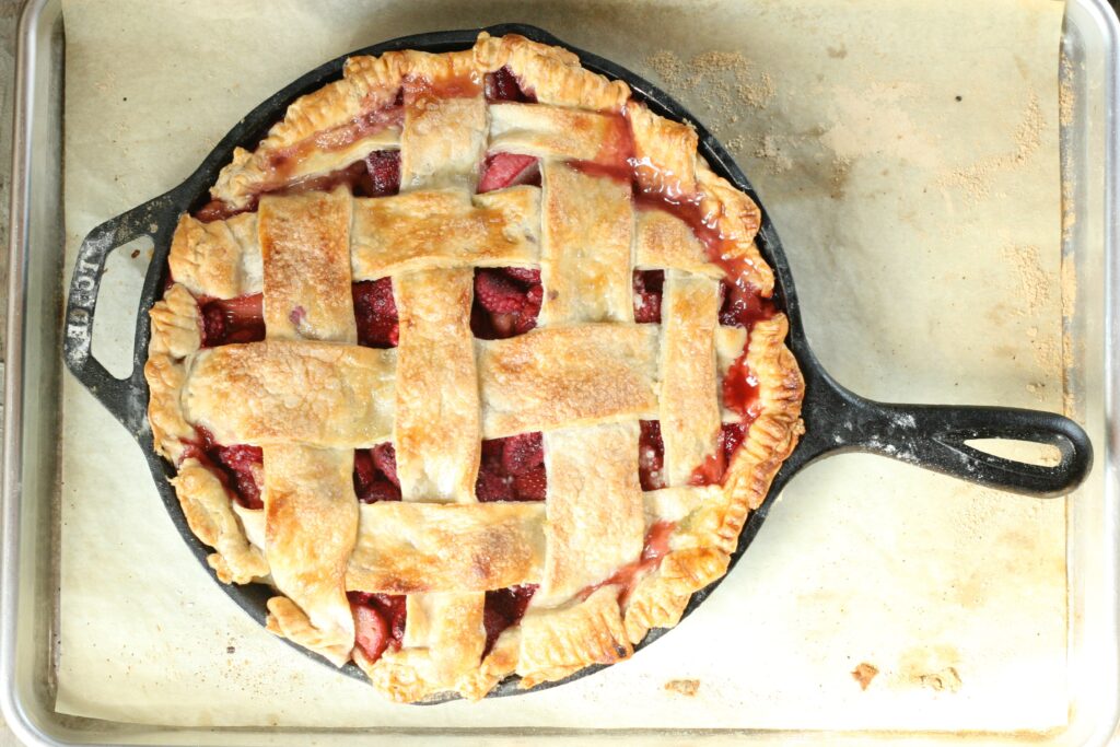 Strawberry Raspberry Rhubarb Pie in cast iron skillet