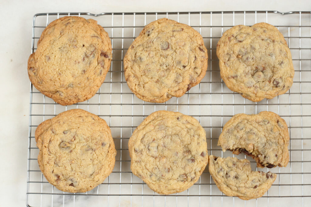 Perfected Chocolate Chip cookies cooling on a baking rack