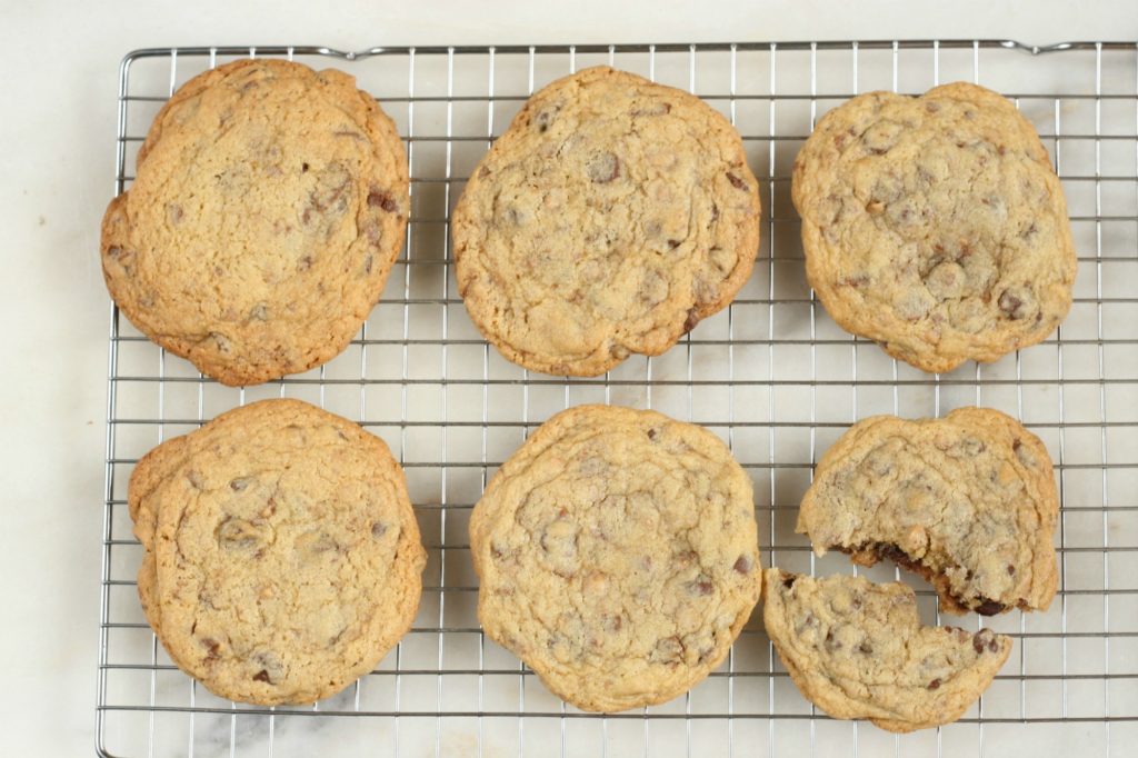 chocolate chip cookies cooling on a baking rack