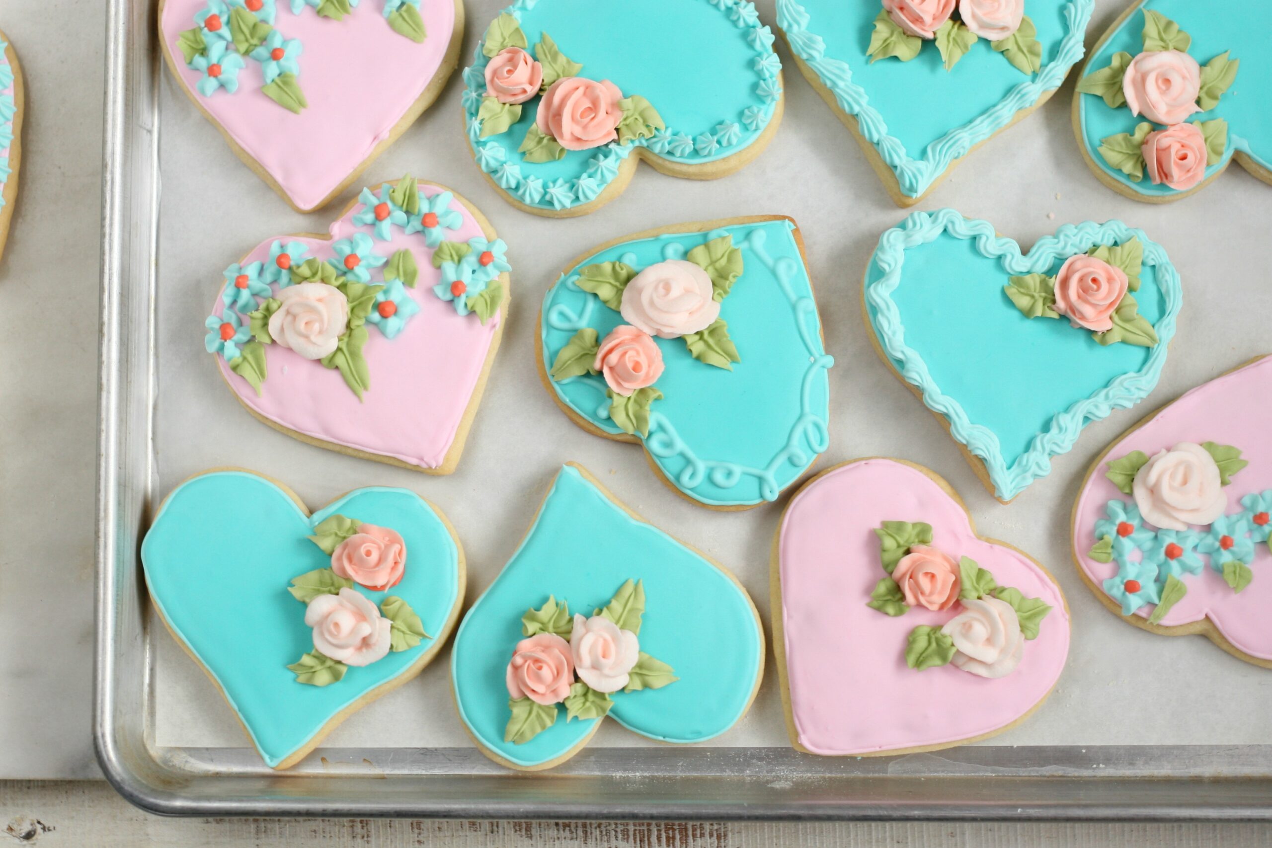 Heart shaped sugar cookies with handmade sugar roses.