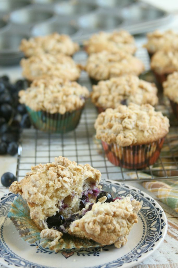 Rustic Blueberry muffins sitting on vintage plate