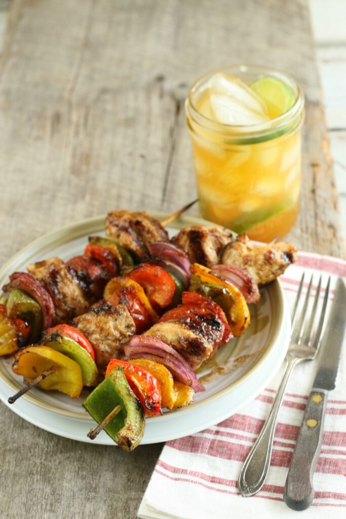 Get to grilling this summer with Sweet Maple Barbecue Chicken Kebabs with bell peppers and onions. #grilling #kebabs #chicken #recipes