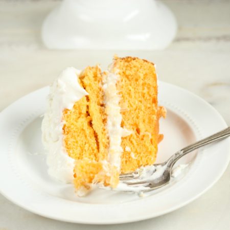 This wonderfully moist Easy Orange Dreamsicle Cake with only a few simple ingredients. Layered with a pineapple and coconut filling. #dreamsiclecake #orangecake #cake #recipes