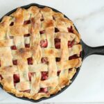 Make this delicious homemade Strawberry Rhubarb Pie with lattice crust. #recipe #strawberryrhubarb #pie #castironrecipes #strawberries
