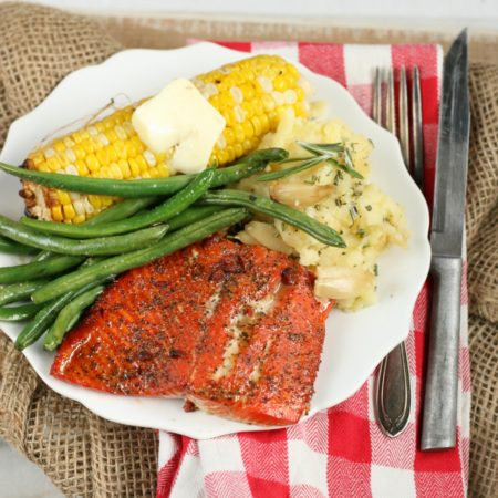 Maple Bacon wild salmon with corn on the cobb, fresh green beans and roasted garlic mashed potatoes