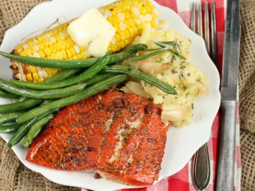 Maple Bacon wild salmon with corn on the cobb, fresh green beans and roasted garlic mashed potatoes