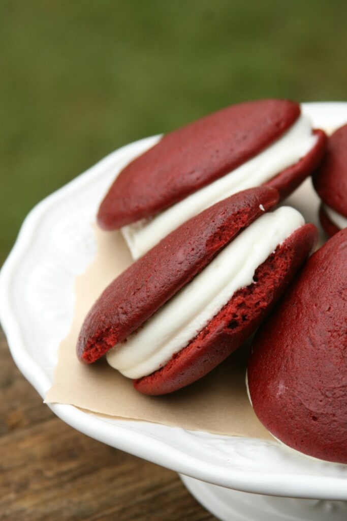 Red Whoopie Pies on a footed cake dish