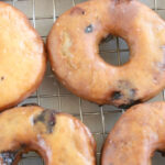 doughnuts with glazed on baking rack drying