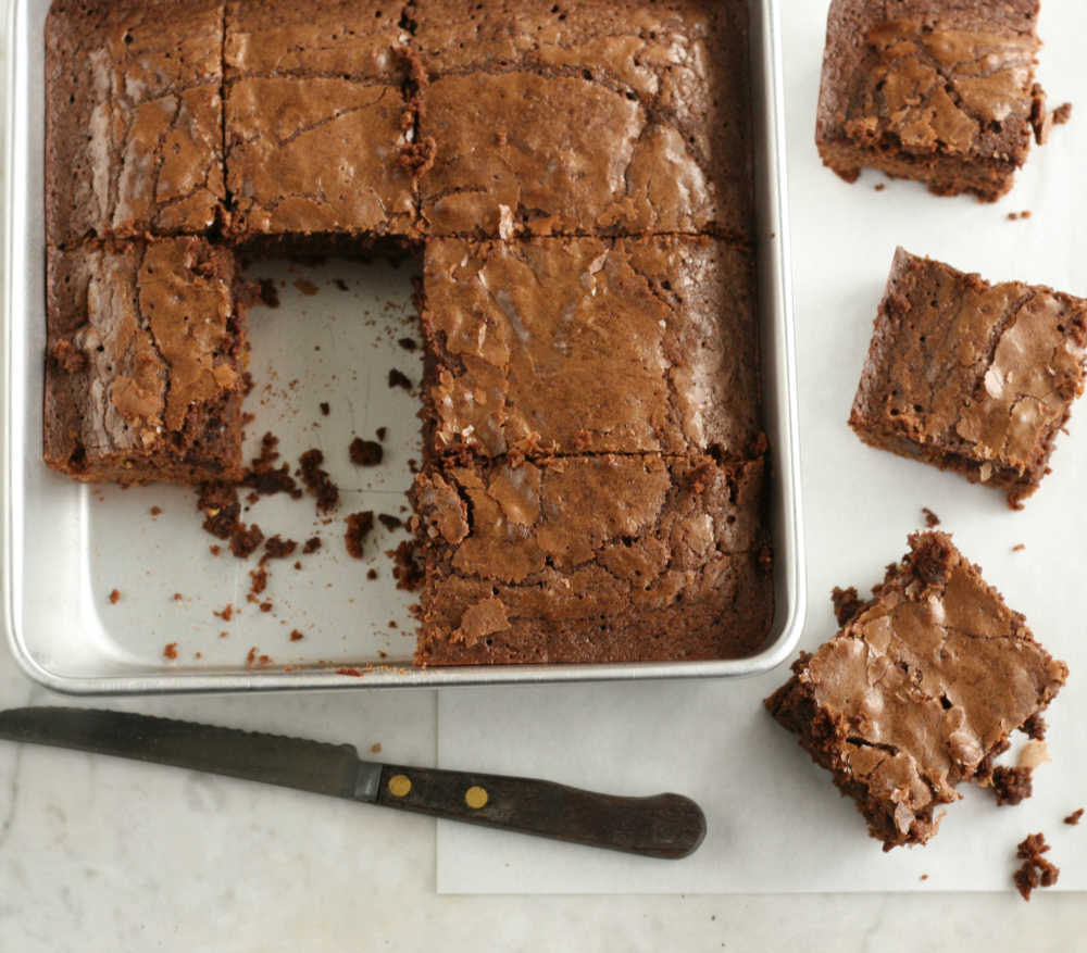 homemade brownies in a metal square baking pan.