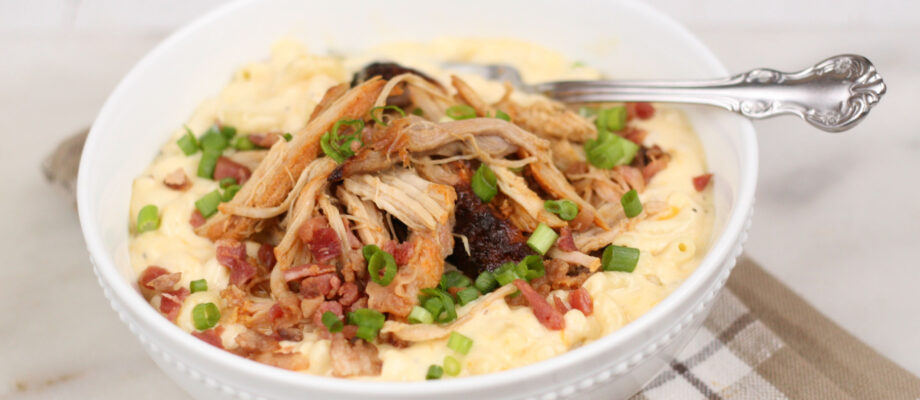 The Best Mac and Cheese Recipe is super creamy and topped with Applewood Bacon Pulled Pork. This dish uses two different kinds of cheeses in a homemade cheese sauce for the ultimate comfort food! #bestmacandcheese #recipes #recipe #kidfriendly #macandcheese #macaroni