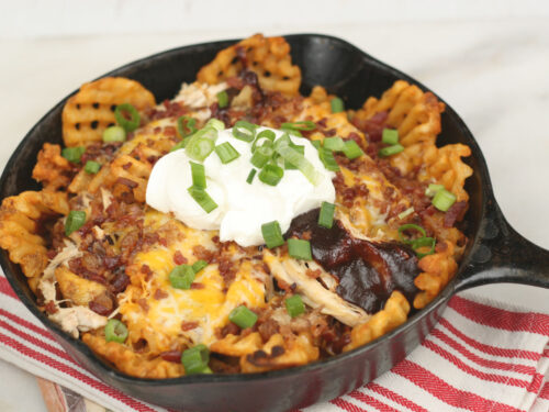 BBQ Chicken loaded fries in a cast iron skillet
