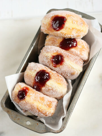 Homemade jelly donuts in a metal loaf pan
