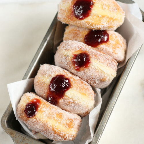 Homemade jelly donuts in a metal loaf pan