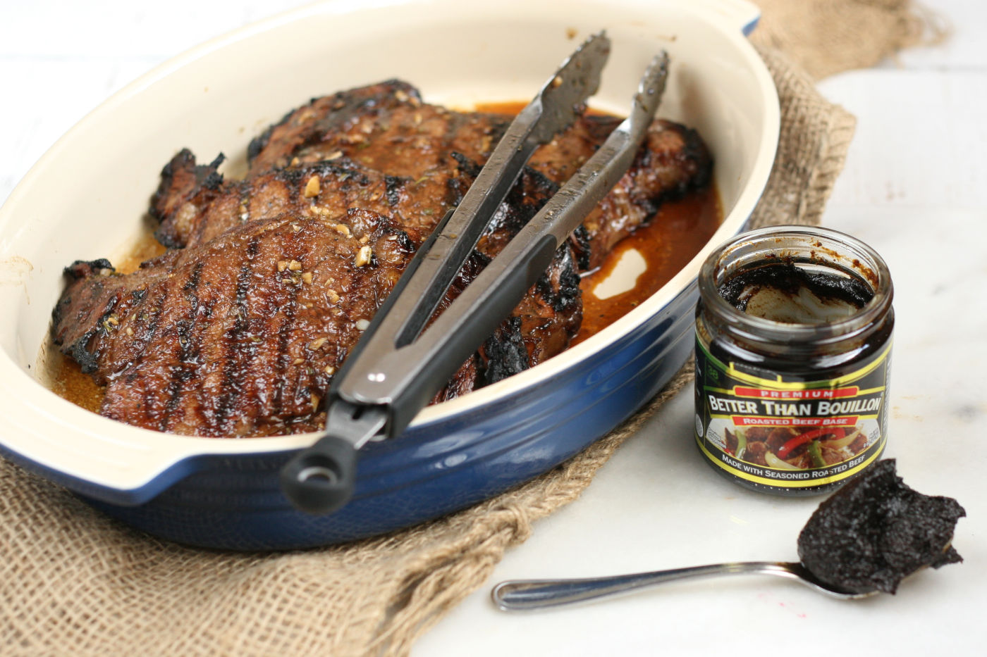 grilled steak in a ceramic dish.