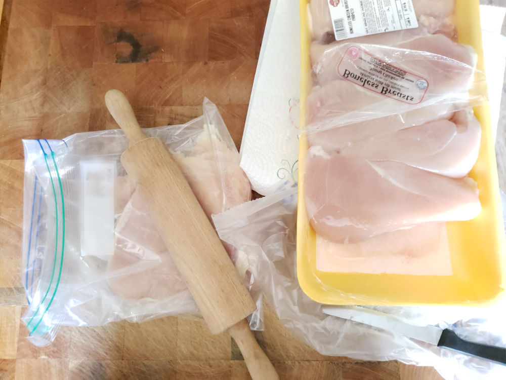 flattening chicken breasts in a ziploc bag