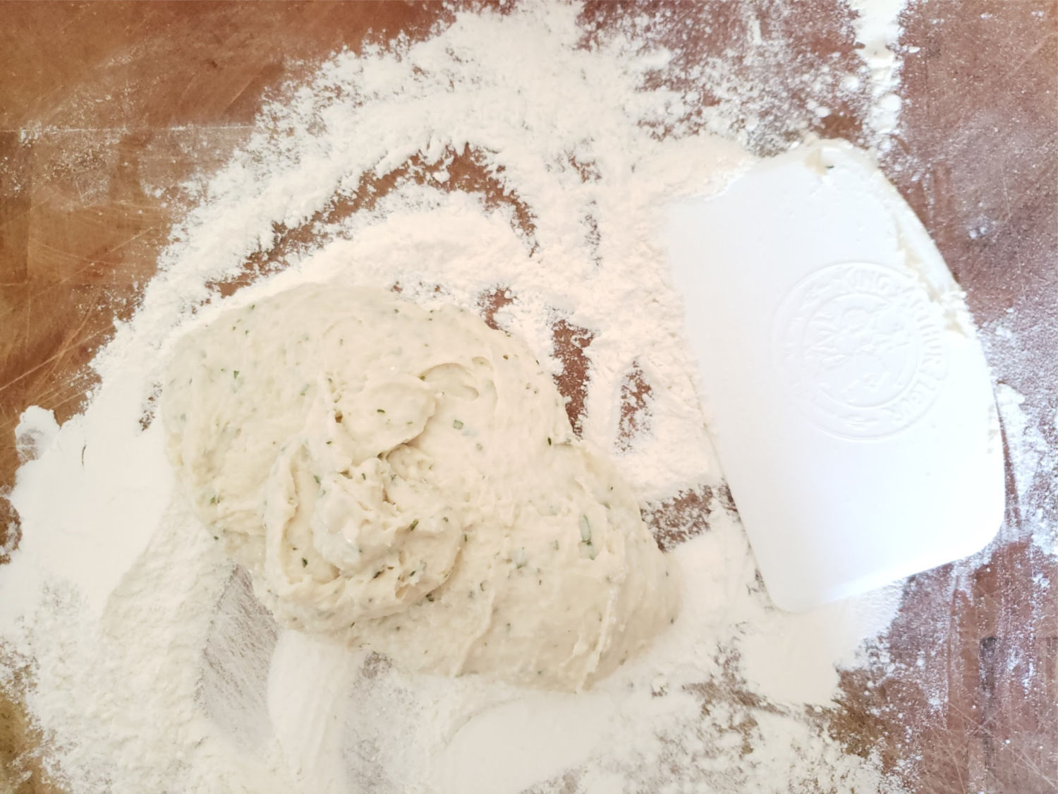 dinner roll dough on floured work surface.