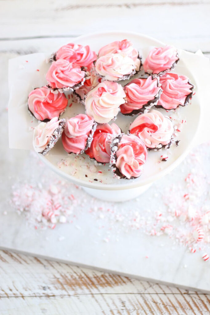 Peppermint meringues on a white footed cake dish