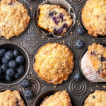 Blueberry muffins in vintage muffin baking pan.
