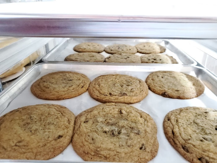 chocolate chip cookies cooling on baking rack