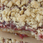 Raspberry bars stacked on each other.