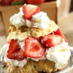 Strawberry shortcake biscuits with fresh strawberries and whipped cream.