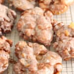 apple fritters on baking rack with glaze drying.
