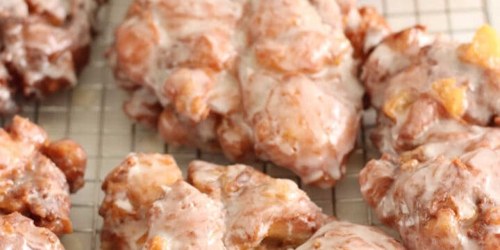 apple fritters on baking rack with glaze drying.