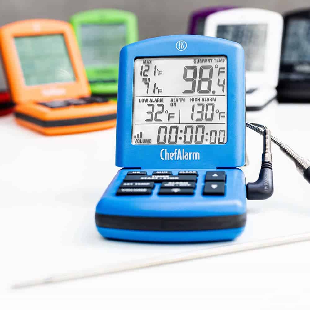 ThermoWorks Chef alarm thermometer with probe in blue and different colors.