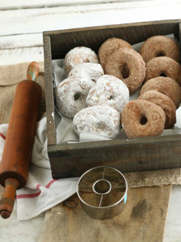 donuts lined up against each other in a wooden box