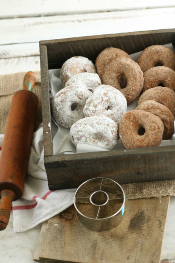 donuts lined up against each other in a wooden box
