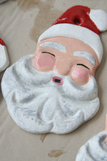 Santa salt dough ornament drying on brown Kraft paper.
