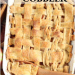 Cobbler with lattice pie crust in white rectangle baking pan.