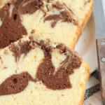 Marble pound cake slices on small white plate.