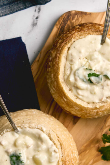 Closeup of clam chowder in bread bowl.