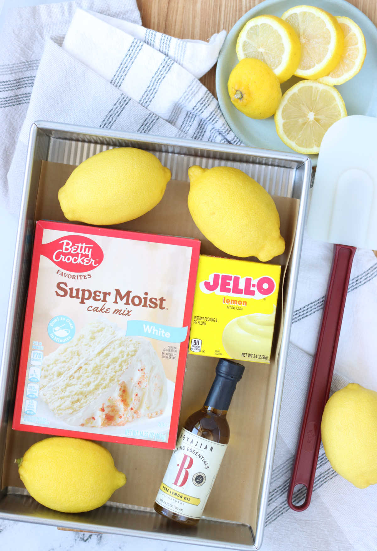 Ingredients for lemon cake in 9x13-inch cake pan.