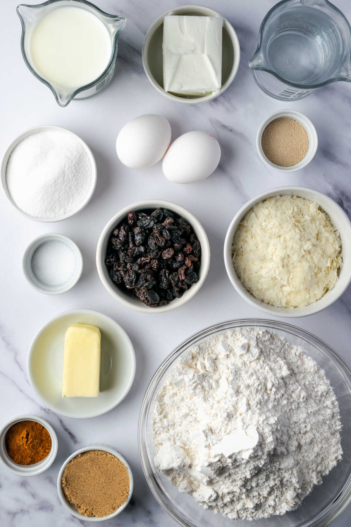 Ingredients for bread on white marble.