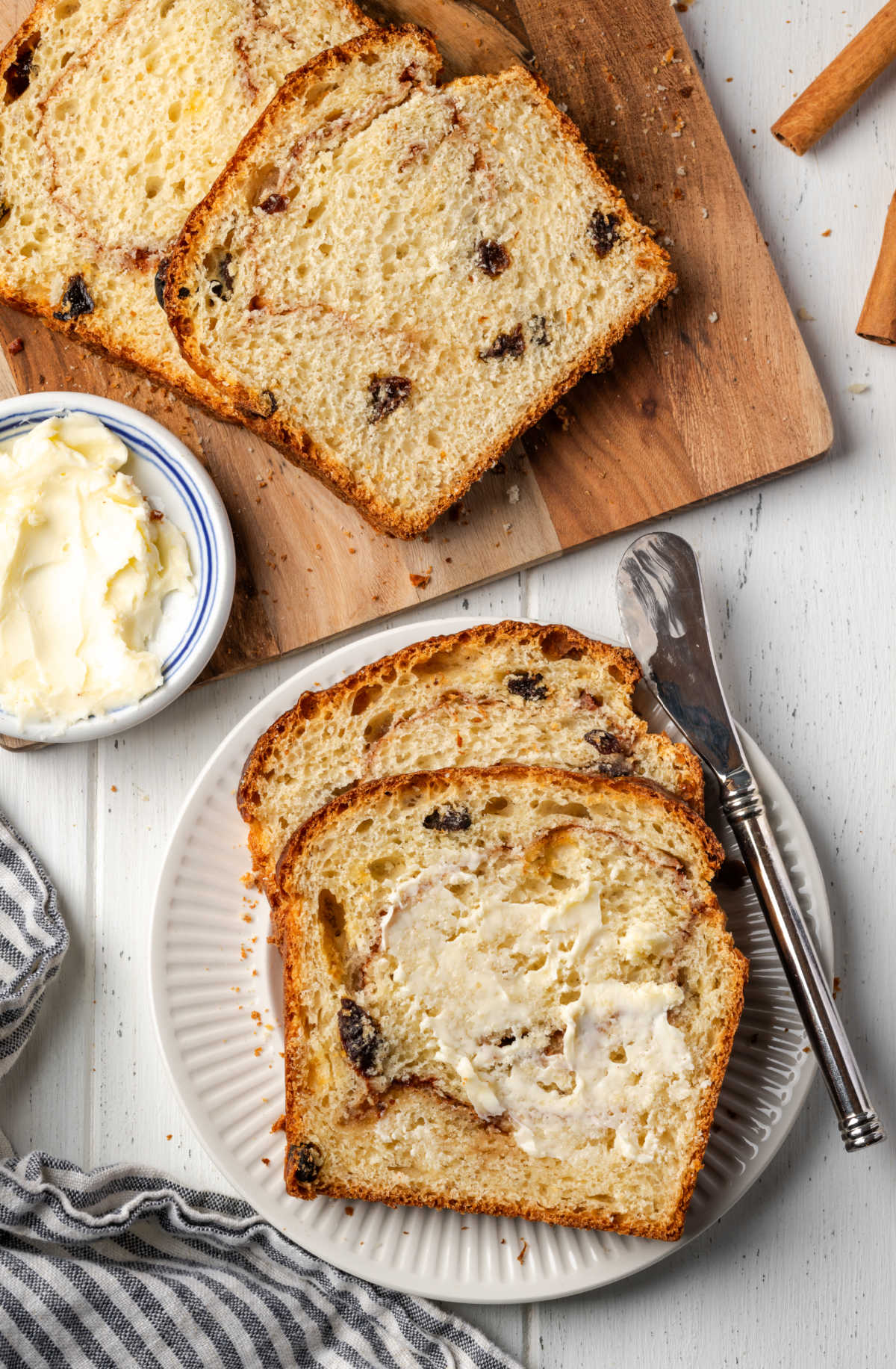 Cinnamon raisin bread partially sliced.