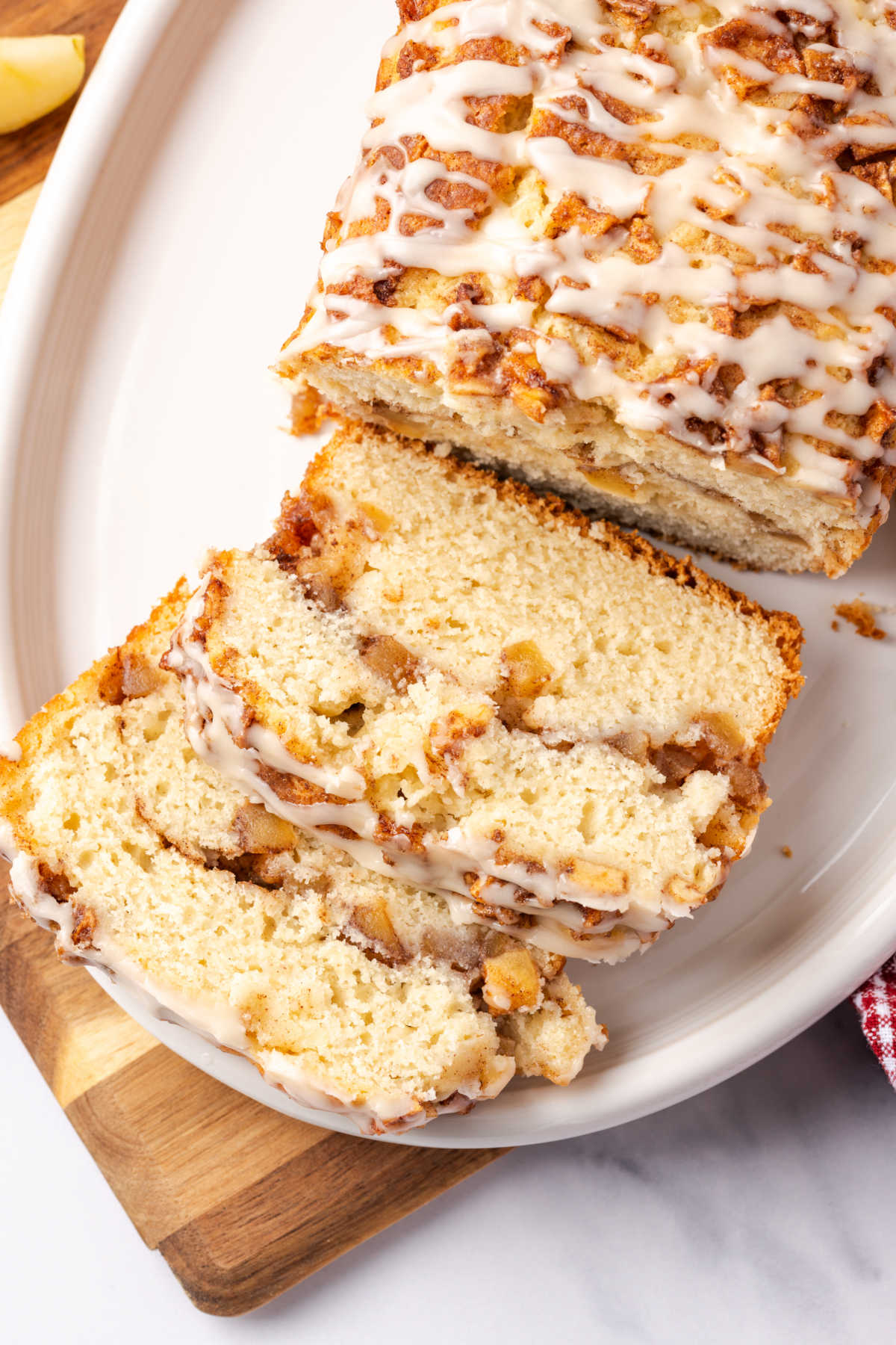 Close up of apple cake slices on white plate.