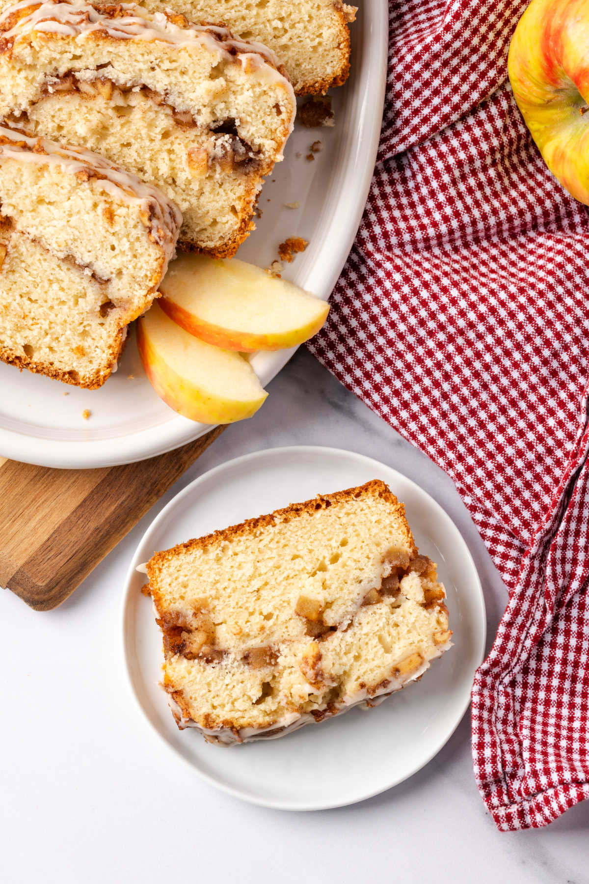 Apple bread sliced on white plate.