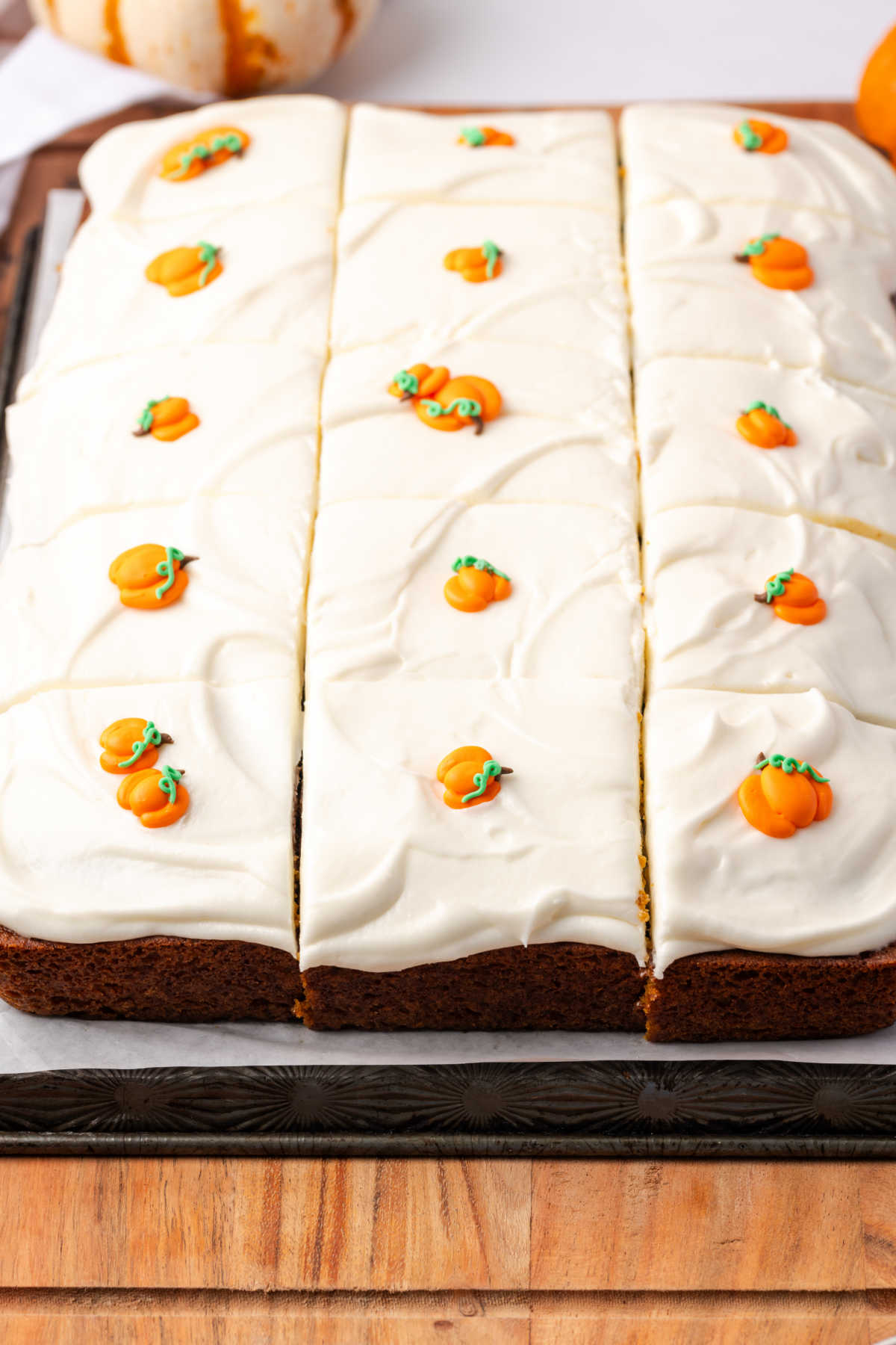 Pumpkin cake with cream cheese frosting, pumpkin candies.
